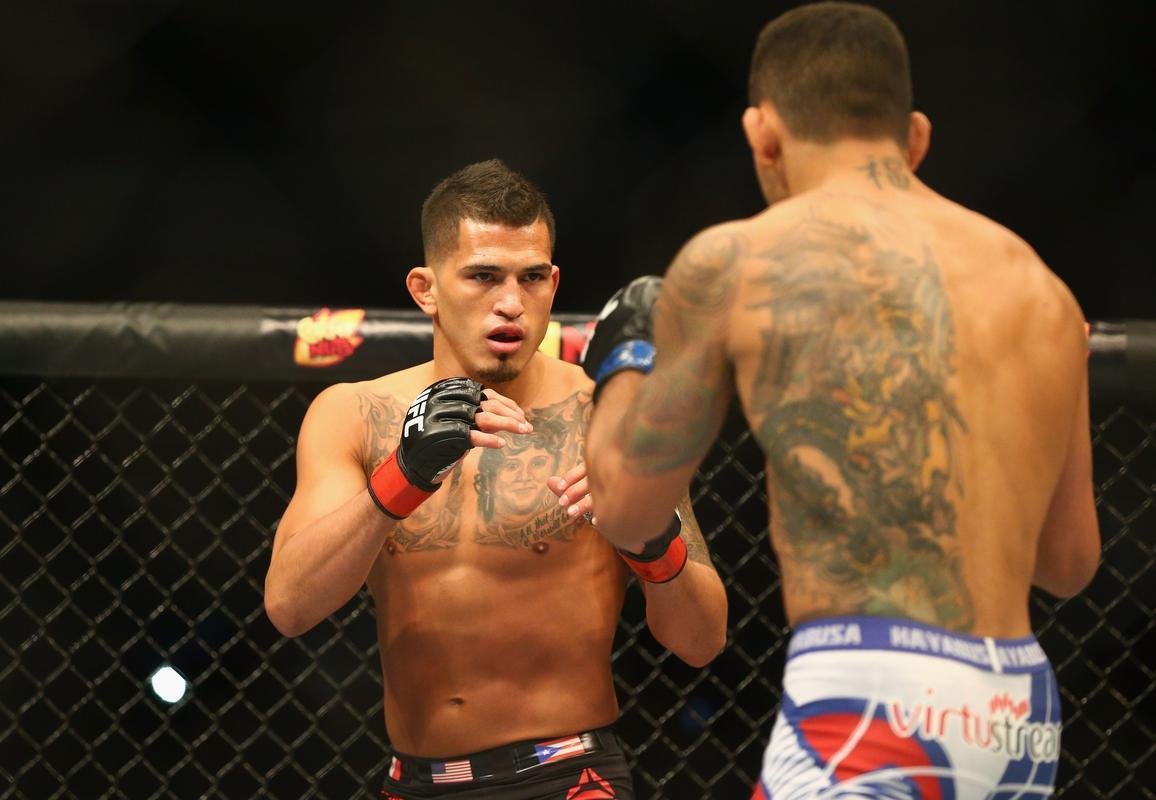 Imagens das lutas e bastidores do UFC 185, em Dallas - Rafael dos Anjos (bermuda azul) venceu Anthony Pettis por deciso unnime e conquistou o cinturo dos leves
