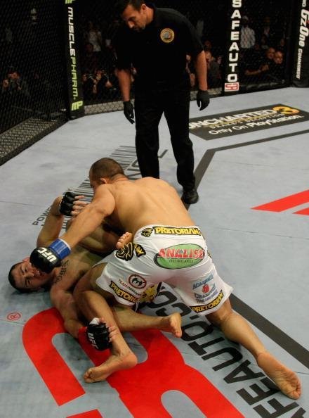 Na primeira defesa de cinturo, Velasquez conheceu a nica derrota de sua carreira. O norte-americano enfrentou o brasileiro Junior Cigano dos Santos e foi nocauteado com pouco mais de um minuto depois de levar um knockdown e uma sequncia de golpes no cho