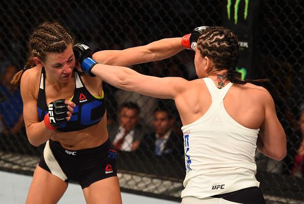 Veja imagens da grande vitria de Miesha Tate (roupa preta) sobre Jessica Eye