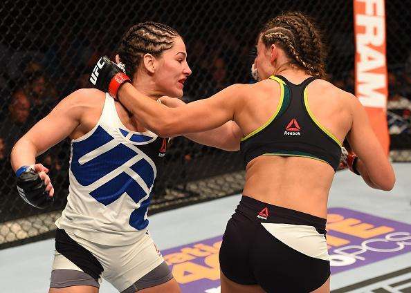 Veja imagens da grande vitria de Miesha Tate (roupa preta) sobre Jessica Eye