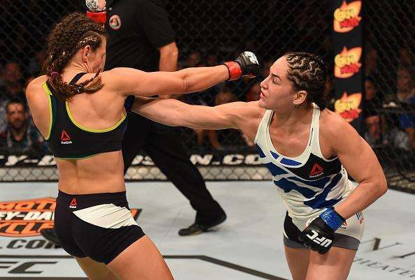 Veja imagens da grande vitria de Miesha Tate (roupa preta) sobre Jessica Eye