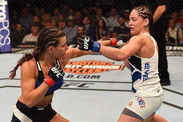 Veja imagens da grande vitria de Miesha Tate (roupa preta) sobre Jessica Eye