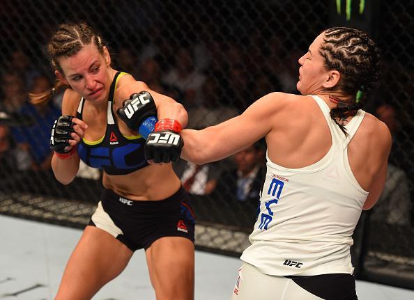 Veja imagens da grande vitria de Miesha Tate (roupa preta) sobre Jessica Eye
