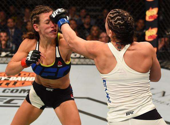 Veja imagens da grande vitria de Miesha Tate (roupa preta) sobre Jessica Eye