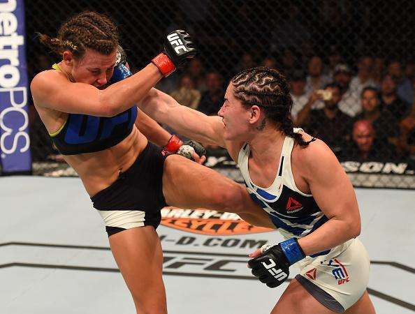 Veja imagens da grande vitria de Miesha Tate (roupa preta) sobre Jessica Eye