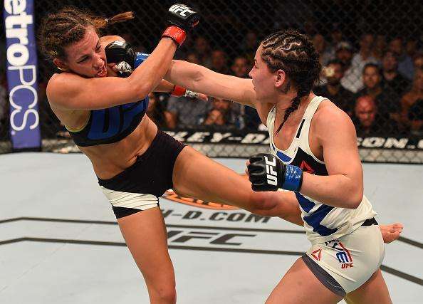 Veja imagens da grande vitria de Miesha Tate (roupa preta) sobre Jessica Eye