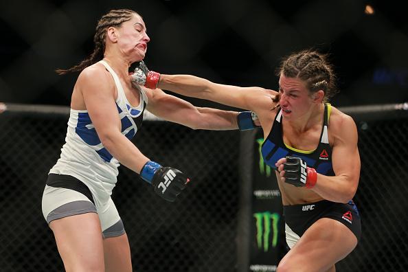 Veja imagens da grande vitria de Miesha Tate (roupa preta) sobre Jessica Eye