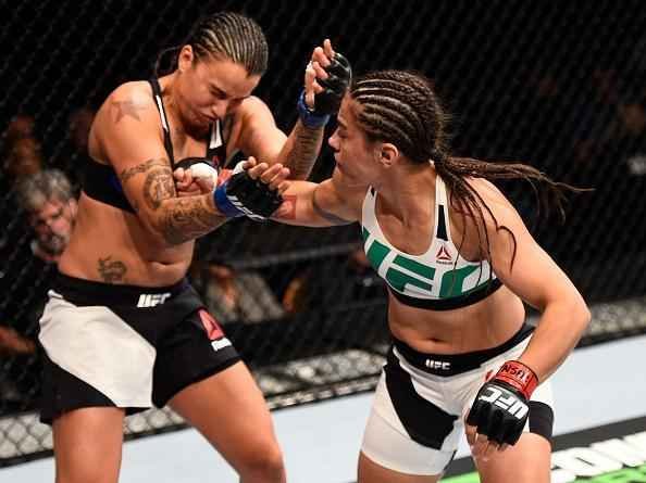 Raquel Pennington (preto) bateu Jssica Andrade por finalizao no UFC 191