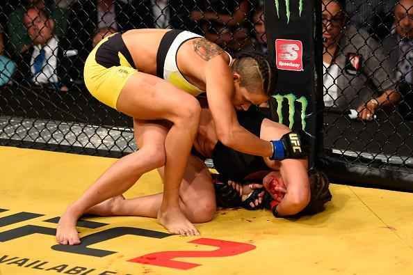 Fotos da grande vitria de Amanda Nunes pelo cinturo do UFC