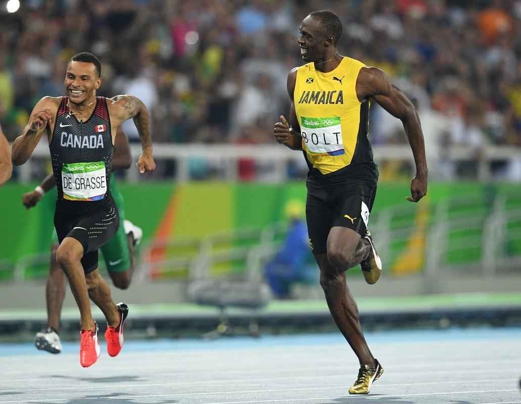 Imagens da disputa entre Bolt e De Grasse na semifinal dos 200m rasos