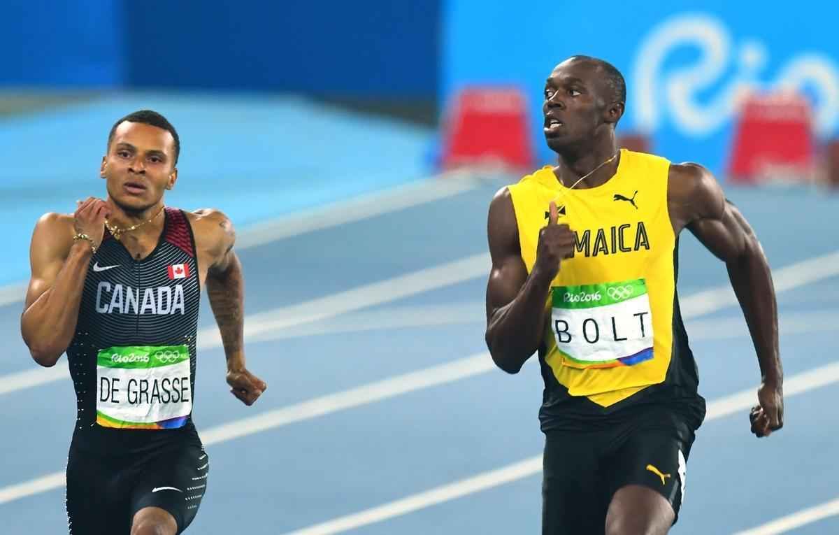 Imagens da disputa entre Bolt e De Grasse na semifinal dos 200m rasos