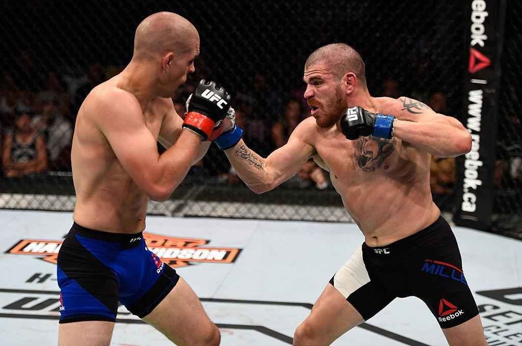 Jim Miller (luvas azuis) venceu Joe Lauzon por deciso dividida 